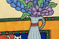 Chakko-on-Rug-with-Blue-Vase-and-Flowers