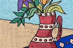 Cinnamon-Vase-with-Eyeballs-on-Blue-Table